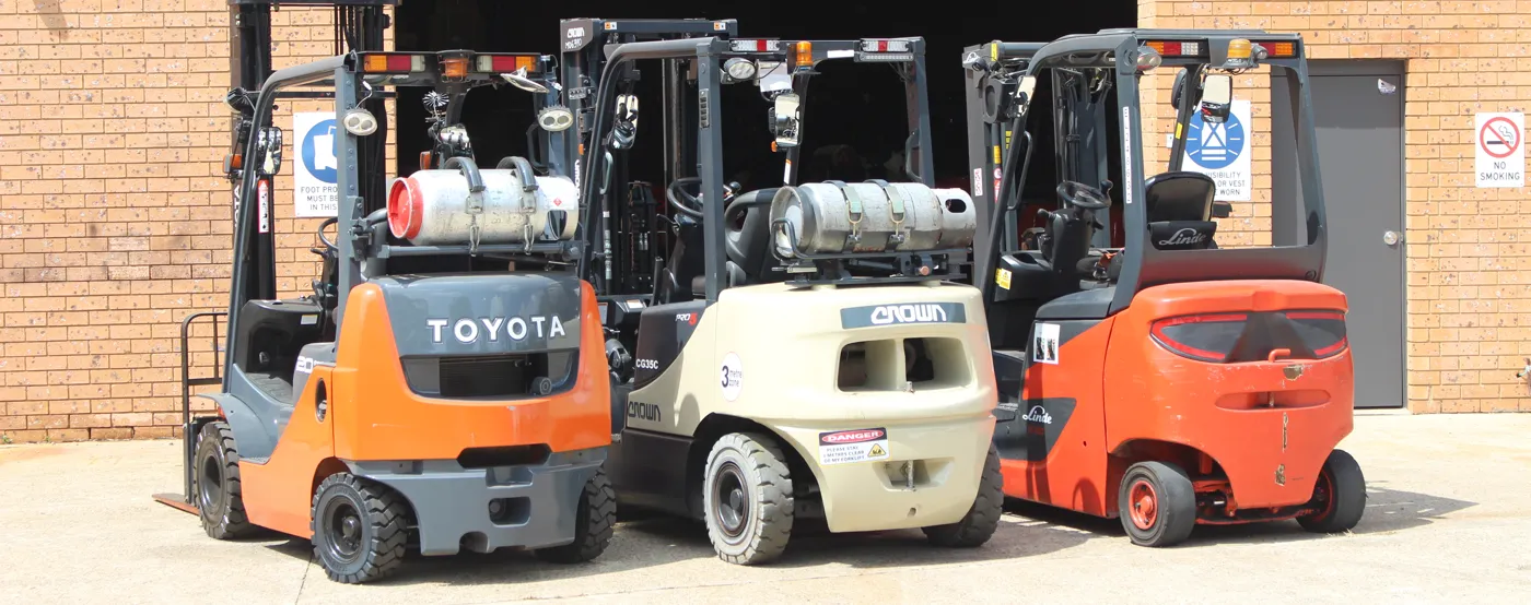 Toyota, Crown and Linde forklifts outside the warehouse